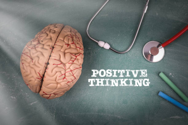 istock POSITIVE THINKING. Doctor's stethoscope and brain model on a green board 1351253020