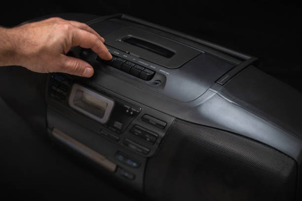 istock pressing buttons on a tape recorder, hand close-up 1351253064