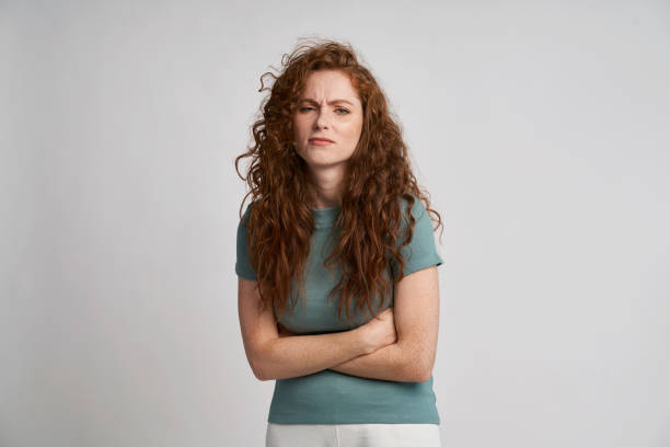 Redhead woman with pain of stomach stock photo