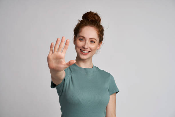 Happy woman with hand raised