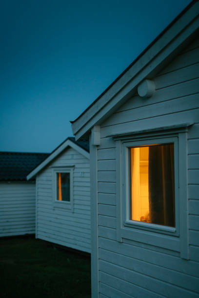Cabin after sunset. Cold climate