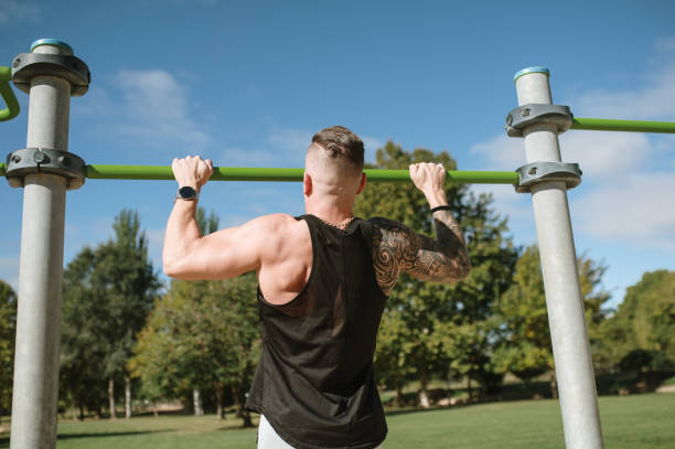 istock Young man working out in a calisthenics park 1351256494
