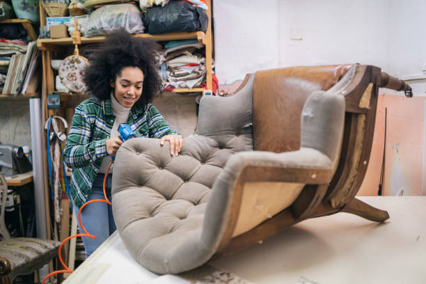 istock Afro Female Refurbishing Chair In Upholstery Workshop 1351256696