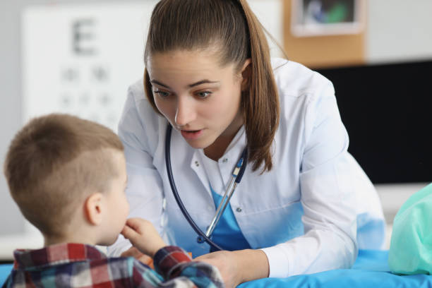 istock Child on doctors appointment at hospital 1351257320