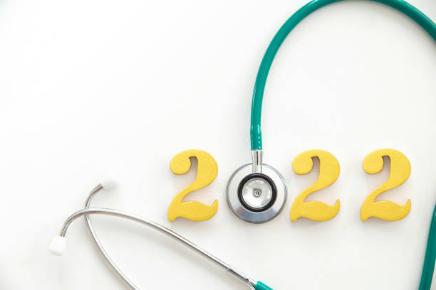 happy new year 2022. golden numbers 2022 with Stethoscope on white background. Happy new year and health medical concept happy new year 2022. golden numbers 2022 with Stethoscope on white background. Happy new year and health medical concept 2022 photos stock pictures, royalty-free photos & images