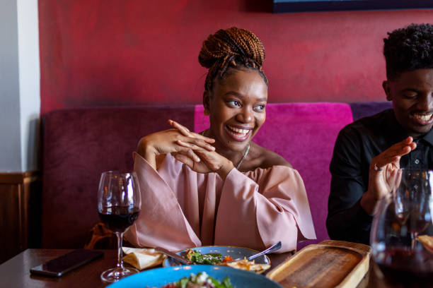 istock Beautiful Smiling Young Woman At The Restaurant 1351257724