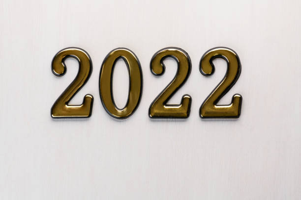 istock Numbers 2022 on white wooden background. Abstract new year backdrop with 2022 year 1351260962