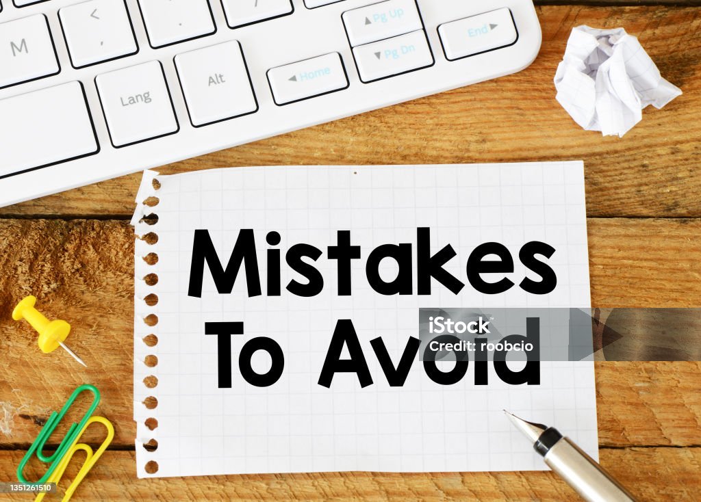 MISTAKES IS AVOID words written in the notebook. Mistake Stock Photo