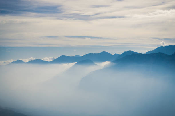 istock Landscape with mountains in the clouds 1351262571