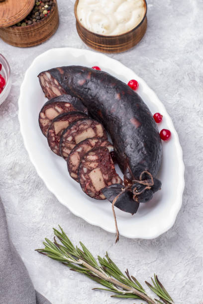 istock Traditional blood sausage on a white plate with cranberries 1351263057