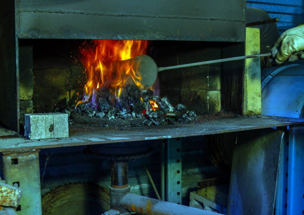 istock Stoking the forge flames with a shovel 1351266803