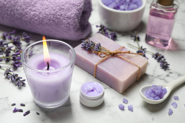 istock Cosmetic products and lavender flowers on white marble table 1351266891