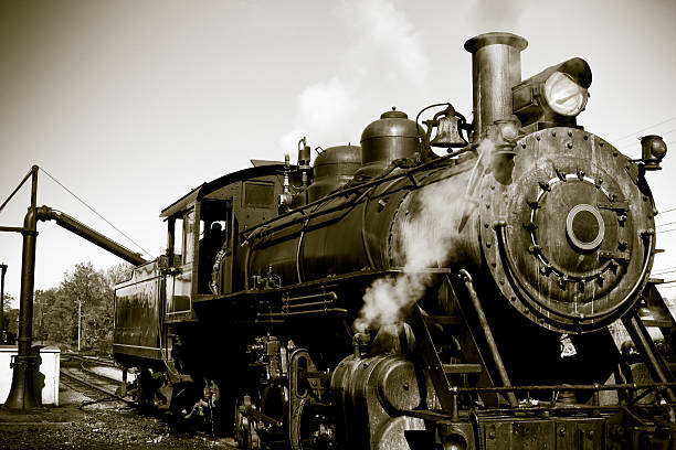 istock Sepia Toned Old Steam Locomotive Engine Reloading Coal 135126748