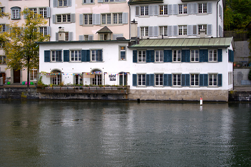 Old town of Zürich with river Limmat on a grey cloudy autumn day. Photo taken October 9th, 2021, Zurich, Switzerland.