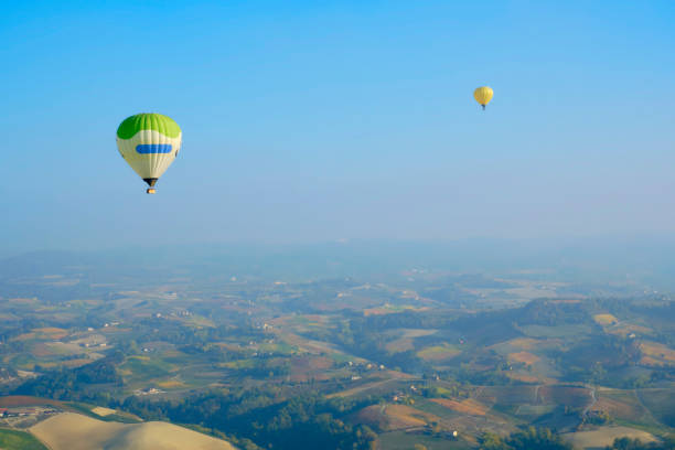 istock Hot air balloon flying over Langhe vineyards. Color image 1351269313