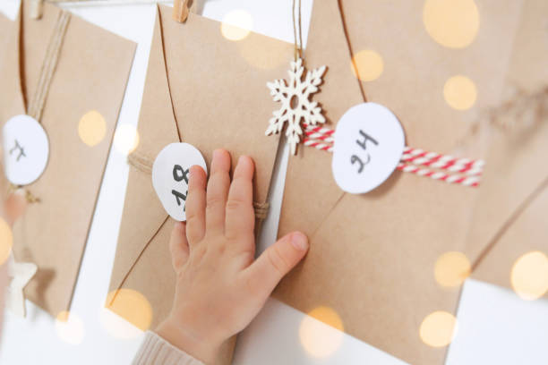 istock A funny baby with hand made advent calendar. 1351269532