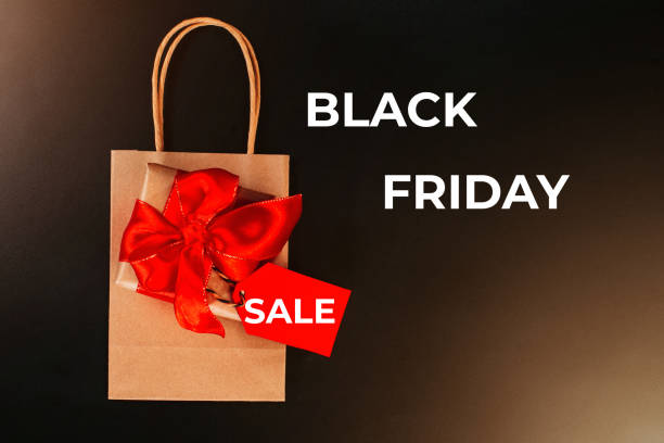istock Gift box on a red background.Minimalism style. Creative design. Copy space. Banner.Sale, discount, shopaholism concept. Consumer society trend.Black Friday Super Sale.Black Friday shopping sale concept with red ticket Sale tag close up. 1351271688