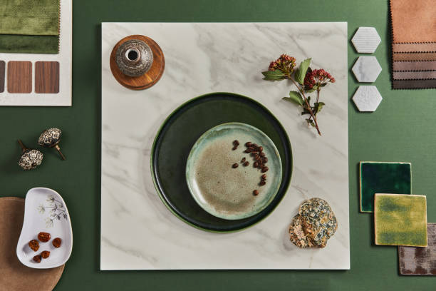 istock Stylish flat lay composition of creative architect mood board design with samples of building, textile and natural materials and personal accessories. Top view, green background, template. 1351275210