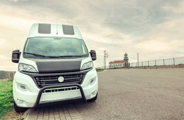 istock Camper van parked near to a lighthouse 1351284163