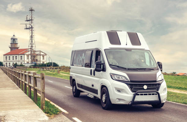istock Camper van traveling near to a lighthouse 1351284185