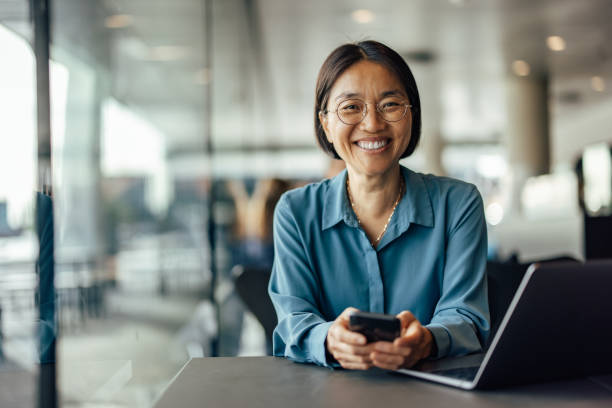 istock Smiling asian woman, going on a lunch break 1351284301