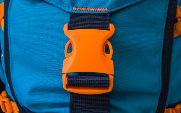 istock Orange plastic belt clip, buckle fastex, length adjusters on bag or backpack strap, fasteners for paracord bracelet 1351285409