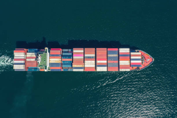 istock Aerial top view container ship full load container for logistics import export, shipping or transportation concept background. 1351285476