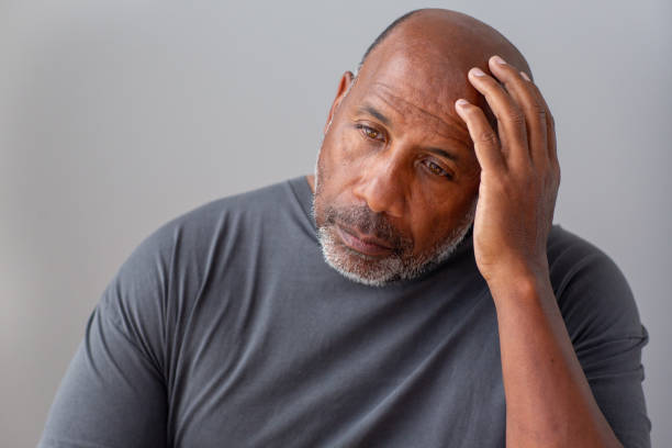 istock Older man not feeling well and having a headache. 1351285620