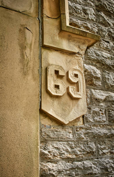 istock Architectural detail of numbers on a stone wall. 1351286726
