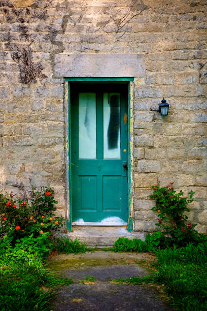 istock Door to an old limestone house. 1351286807