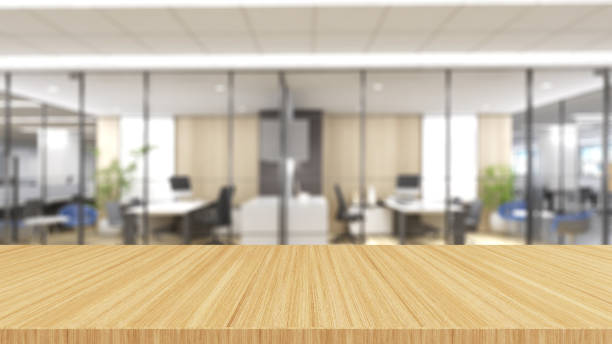 istock wood desk on blurry office background 1351288971