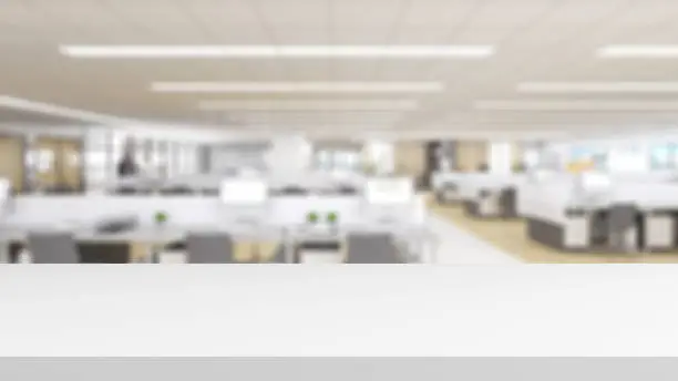 Photo of white desk on blurry office background