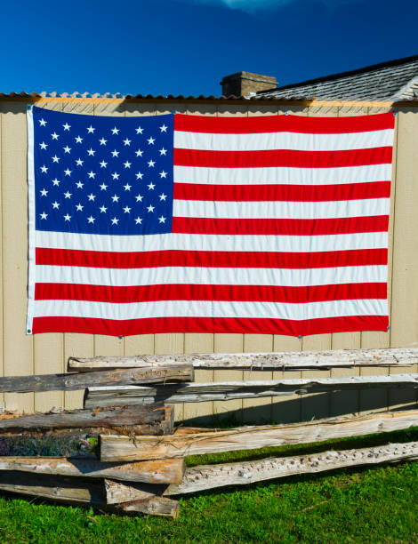 istock American Flag on Shed with blue sky. 1351290784