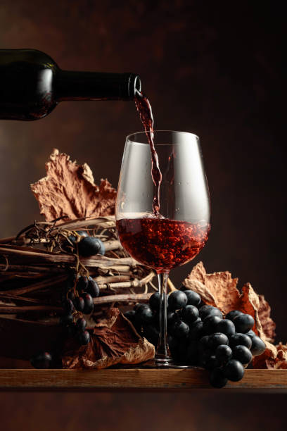 istock Wine is poured into a glass. 1351292846