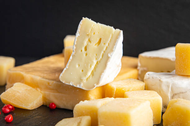 istock cheese plate assorted cheeses aperitif antipasto brie, camembert, cheddar, parmesan and others ready to eat meal snack on the table copy space food background rustic. top view 1351294593