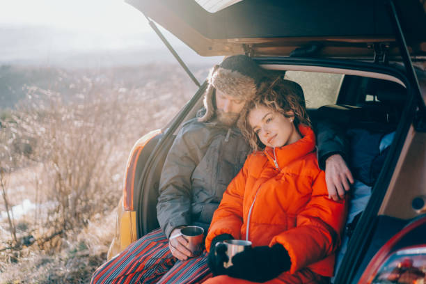 istock Couple on road trip drinks hot tea 1351297448