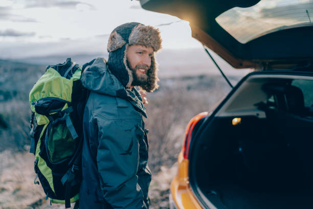 istock Man taking luggage from the car 1351297514