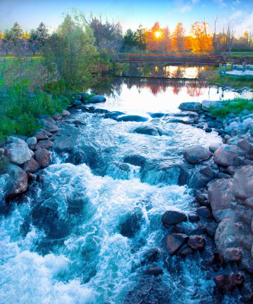 istock Waterfall and bridge at Sunset-AuSable River, Grayling, Michigan 1351299373