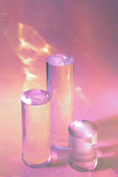 istock three clear glass cylinder podiums on pastel pink background 1351300509