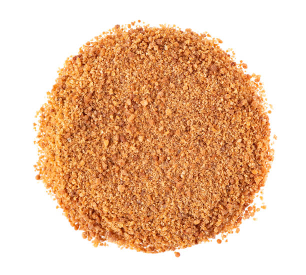 istock Coconut sugar isolated on white background. Brown unrefined coconut palm sugar. Top view. 1351302938