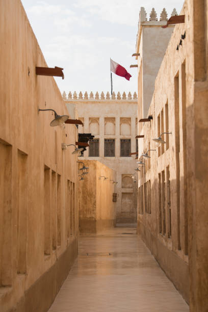 istock Traditional Arabian building with Qatar flag 1351305525