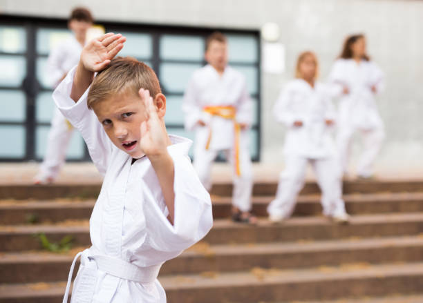istock Boy in kimono standing in front of camera 1351306318