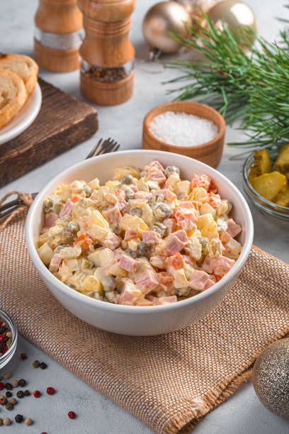 istock Olivier salad in a white bowl on a Christmas background 1351306512