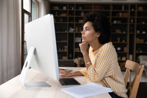 istock Focused young african american businesswoman working on computer. 1351308212