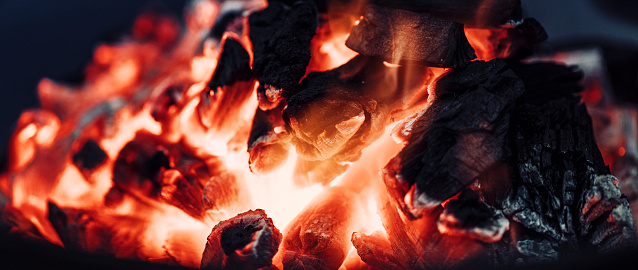 Charcoal fire, resources consumed for heating,  Close up shoot of coals that have turned into embers