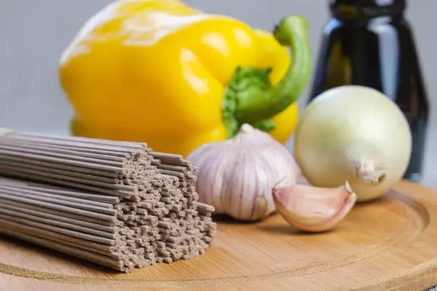 Photo of Dry Soba buckwheat noodles and ingredients for preparing an Asian dish