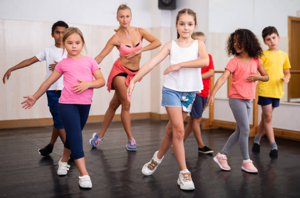 istock Boys and girls training in dance studio 1351312346