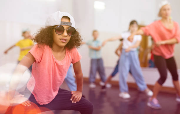 istock Afro girl hip hop dancer performing at class 1351312355