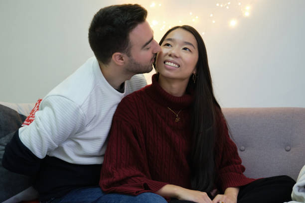 istock Man with Christmas surprise present for his girlfriend. 1351314077