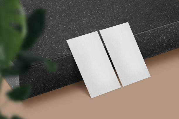 istock Clean minimal business card mockup on black stone plate side background 1351314214